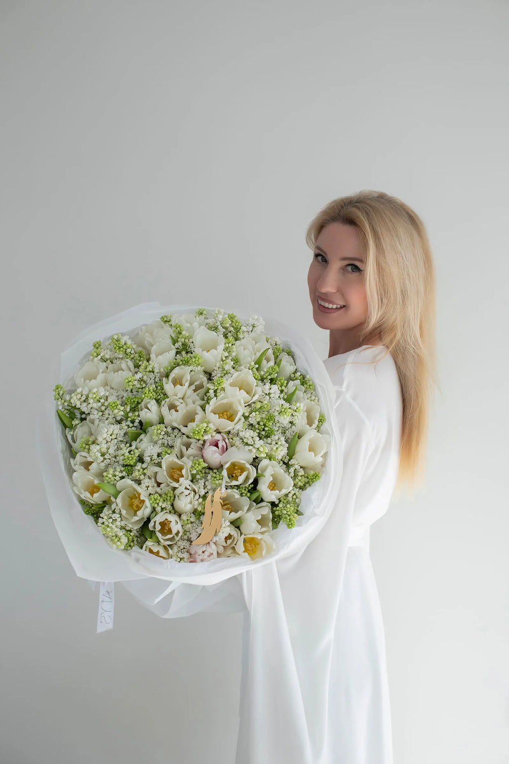 Spring bouquet of lilac branches and tulips by ALys Studio Dubai