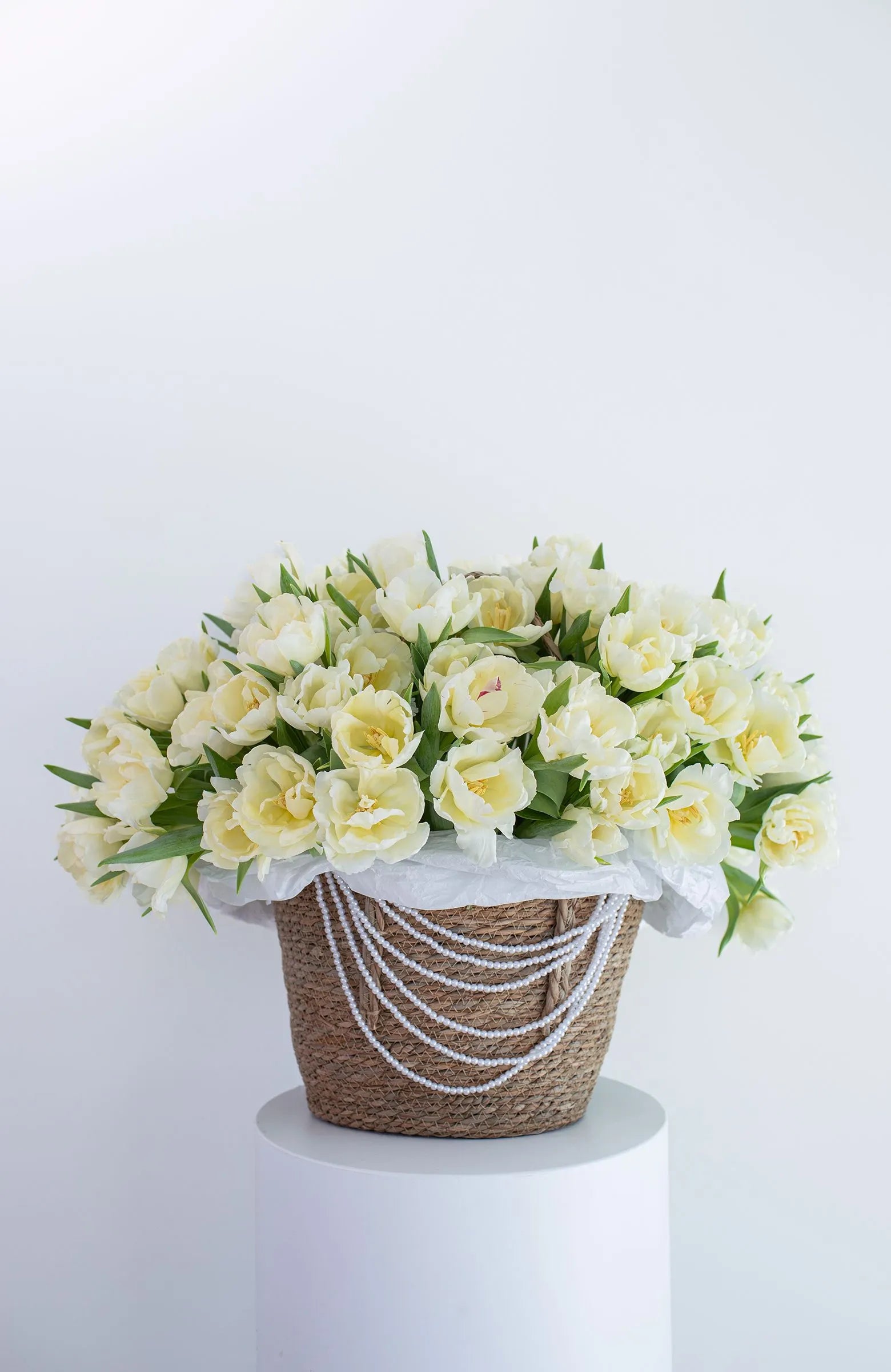 Charming basket of fresh tulips by ALys Studio Dubai