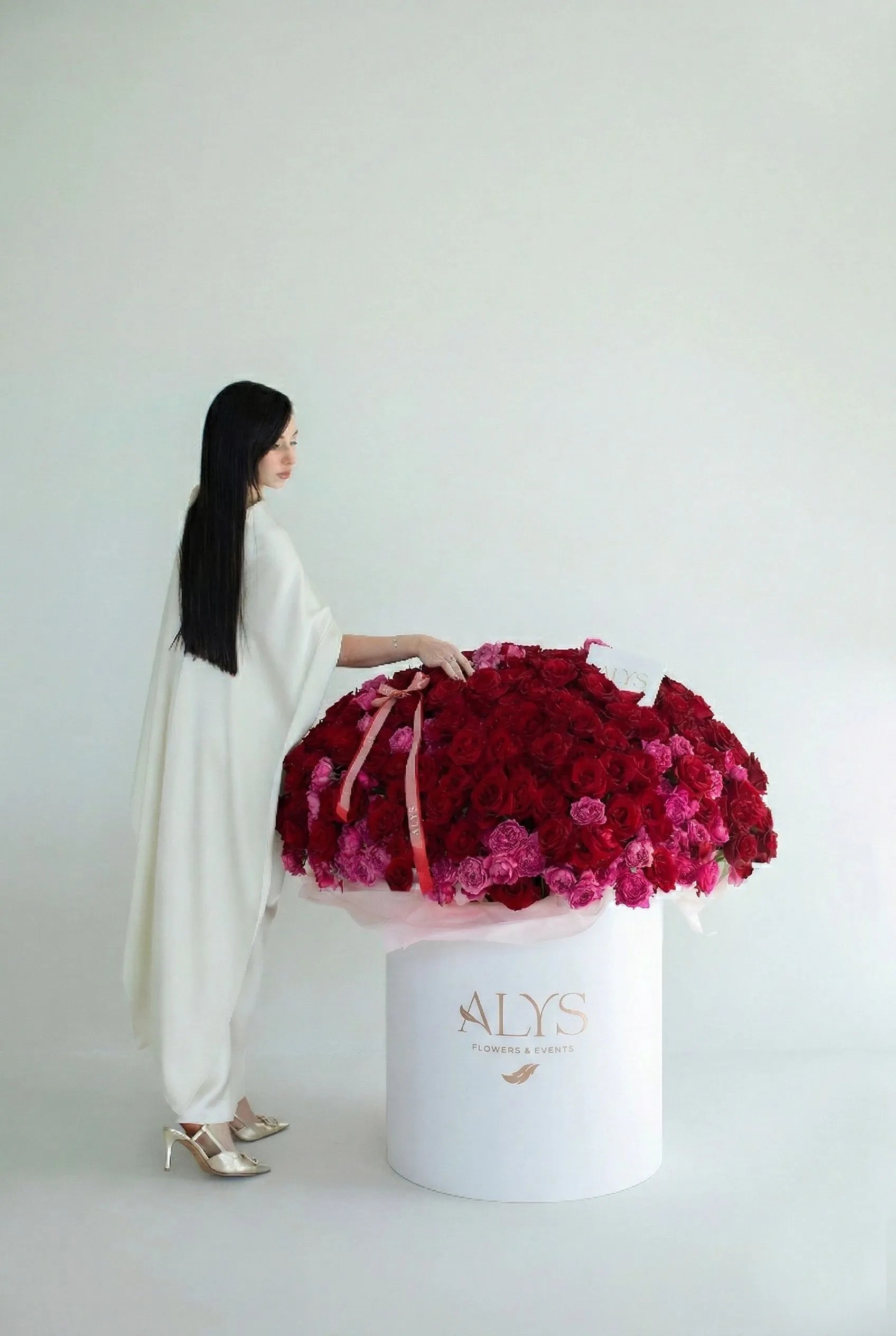 Large box of red roses and premium peony roses by ALys Studio Dubai