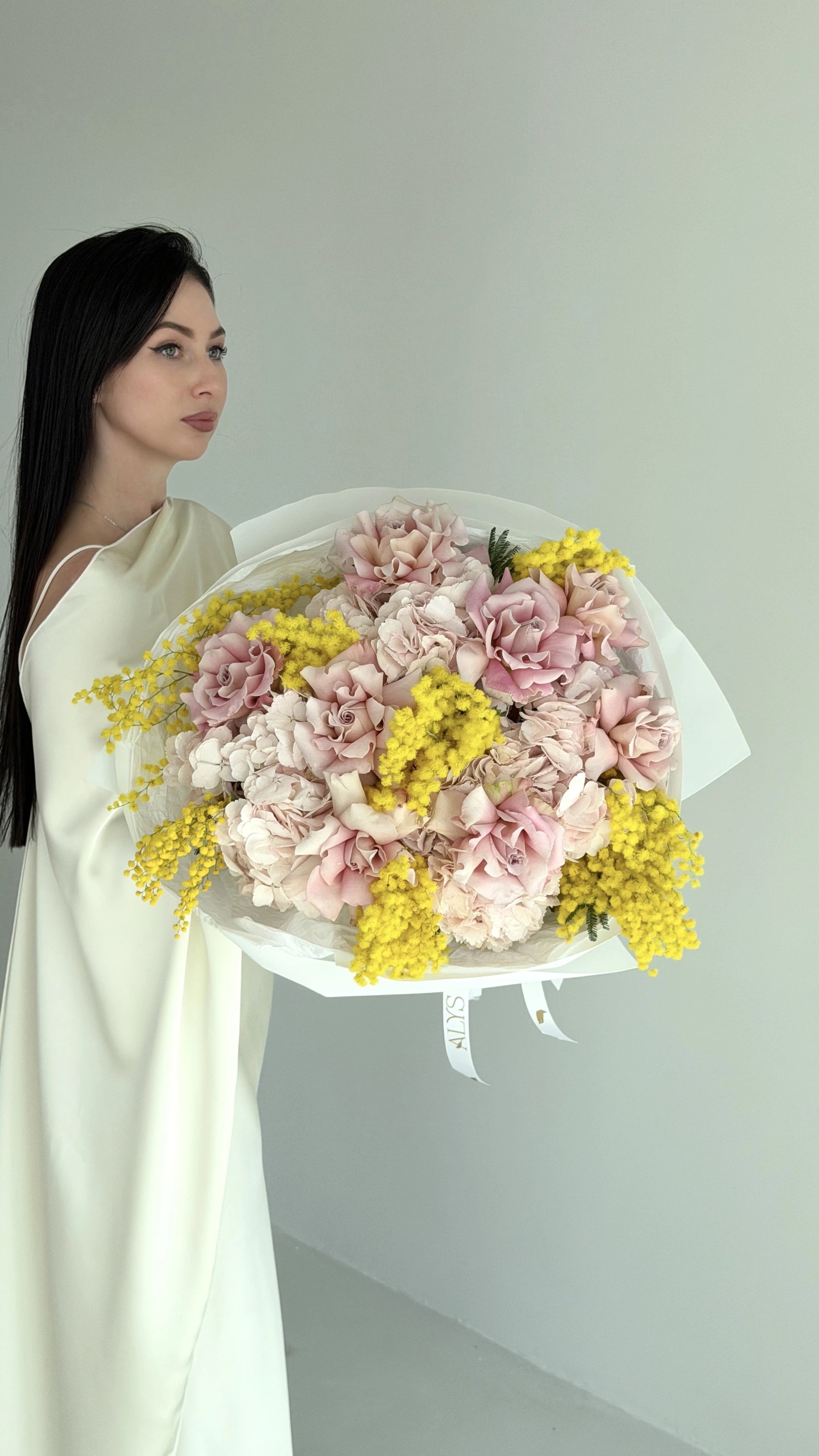 Spring bouquet of mimosa, roses and hydrangea by ALys Studio Dubai
