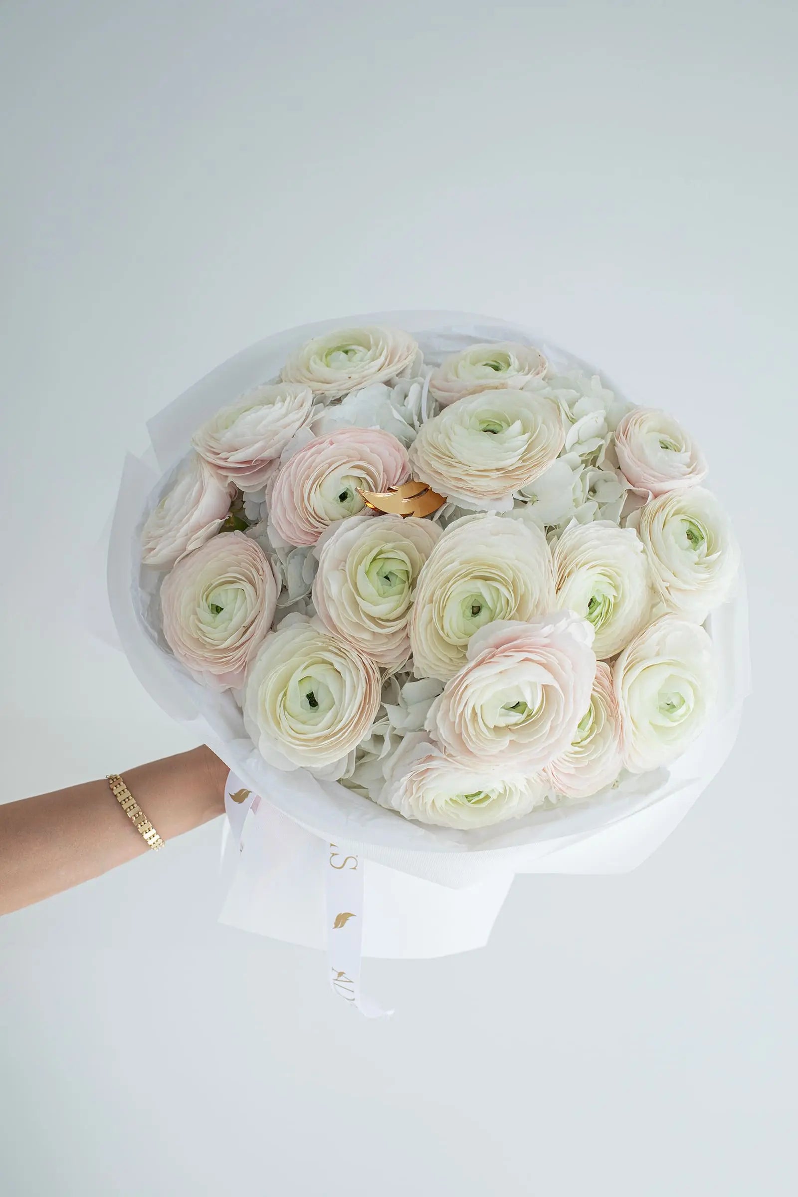 Soft bouquet of hydrangeas and ranunculus in pastels by ALys Studio Dubai