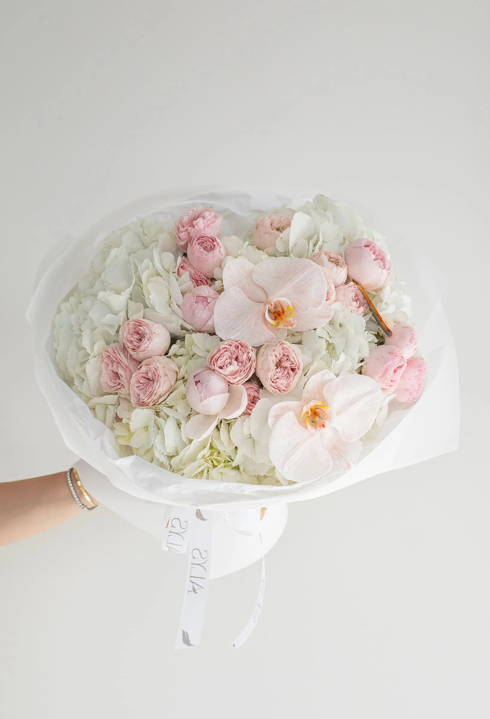Refined bouquet of peony roses, orchids and hydrangea by ALys Studio Dubai